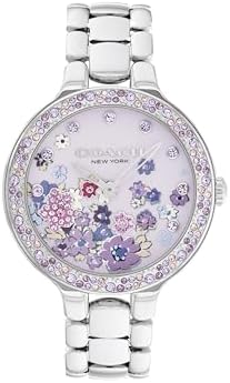 COACH Chelsea women's quartz watch with crystal-set floral bezel on a wrist.