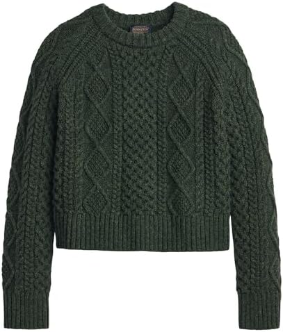 Woman in Pendleton Fisherman Sweater, enjoying a cozy moment indoors.